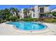 Community pool with plenty of lounge chairs at 240 Windward Psge # 605, Clearwater Beach, FL 33767