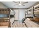 Bedroom with two bunk beds, a ceiling fan and sliding door at 240 Windward Psge # 605, Clearwater Beach, FL 33767