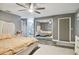 Bright bedroom with large mirror closet doors and en-suite bathroom access at 240 Windward Psge # 605, Clearwater Beach, FL 33767