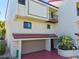 Two-story townhome with attached garage and balcony at 240 Windward Psge # 605, Clearwater Beach, FL 33767