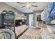 Bedroom with two bunk beds, a ceiling fan and access to a bathroom at 240 Windward Psge # 605, Clearwater Beach, FL 33767