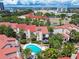Aerial view of community showing homes, landscaping and pool at 240 Windward Psge # 605, Clearwater Beach, FL 33767