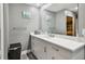 Clean bathroom with single vanity and a relaxing coastal theme at 240 Windward Psge # 605, Clearwater Beach, FL 33767