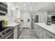 Updated kitchen featuring white shaker cabinets and stainless steel appliances at 240 Windward Psge # 605, Clearwater Beach, FL 33767