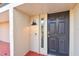 Dark brown front door with sidelights and keyless entry at 240 Windward Psge # 605, Clearwater Beach, FL 33767