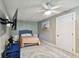 Cozy bedroom featuring a queen bed and ceiling fan at 240 Windward Psge # 605, Clearwater Beach, FL 33767