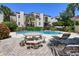 Inviting community pool with patio furniture, perfect for relaxation at 240 Windward Psge # 605, Clearwater Beach, FL 33767