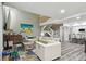 Bright living room with vaulted ceilings, modern furniture, and hardwood floors at 240 Windward Psge # 605, Clearwater Beach, FL 33767