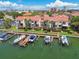 Aerial view of community with private boat docks and lush landscaping at 240 Windward Psge # 605, Clearwater Beach, FL 33767
