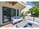 Spacious balcony with comfortable seating and a view at 240 Windward Psge # 605, Clearwater Beach, FL 33767