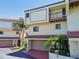 Two-story townhome with attached garage and balcony at 240 Windward Psge # 605, Clearwater Beach, FL 33767