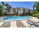 Refreshing kidney-shaped pool and surrounding patio at 240 Windward Psge # 605, Clearwater Beach, FL 33767