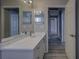 Bathroom with a vanity, a toilet, and a view of the hallway at 19334 Autumn Woods Ave, Tampa, FL 33647