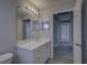 Bathroom with a vanity, a toilet, and a view of the hallway at 19334 Autumn Woods Ave, Tampa, FL 33647