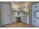 Bathroom features a double sink vanity with white cabinets and tile flooring at 19334 Autumn Woods Ave, Tampa, FL 33647