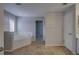 Bright bathroom featuring a white soaking tub, tile flooring, and a window at 19334 Autumn Woods Ave, Tampa, FL 33647