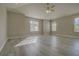 Large bedroom offers natural light with a ceiling fan and light gray paint at 19334 Autumn Woods Ave, Tampa, FL 33647