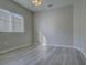 Bright bedroom features a ceiling fan and a window with horizontal blinds at 19334 Autumn Woods Ave, Tampa, FL 33647