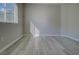 Bright bedroom features a window with horizontal blinds and outlets at 19334 Autumn Woods Ave, Tampa, FL 33647