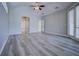 Spacious bedroom with neutral walls, vaulted ceilings, and access to the outdoors through large sliding doors at 19334 Autumn Woods Ave, Tampa, FL 33647