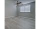 Bright bedroom featuring a ceiling fan and a large window with blinds at 19334 Autumn Woods Ave, Tampa, FL 33647