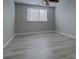 Bright bedroom features a ceiling fan and a window with horizontal blinds at 19334 Autumn Woods Ave, Tampa, FL 33647