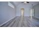 Large bedroom with a ceiling fan, neutral walls, and stylish flooring, offering a serene and comfortable space at 19334 Autumn Woods Ave, Tampa, FL 33647