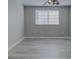 Bedroom with a window with shutter blinds and a ceiling fan at 19334 Autumn Woods Ave, Tampa, FL 33647
