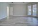 Spacious bedroom with doors to the outside, neutral flooring and walls, offering a bright and airy feel at 19334 Autumn Woods Ave, Tampa, FL 33647