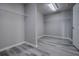 Walk-in closet features gray walls, wood-look flooring, and wire shelving at 19334 Autumn Woods Ave, Tampa, FL 33647