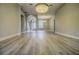 Inviting foyer showcasing hardwood floors, neutral walls, and natural light from the front door at 19334 Autumn Woods Ave, Tampa, FL 33647