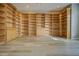 Bright office space with built-in wooden bookshelves surrounding the room, offering abundant storage at 19334 Autumn Woods Ave, Tampa, FL 33647