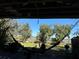 Relaxing backyard view with hammock and partial water view at 33255 State Road 70 E, Myakka City, FL 34251