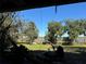 Relaxing backyard view with trees and partial water view at 33255 State Road 70 E, Myakka City, FL 34251