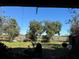 Relaxing backyard view with trees and partial water view at 33255 State Road 70 E, Myakka City, FL 34251