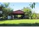 Red barn-style covered structure with ample space for storage at 33255 State Road 70 E, Myakka City, FL 34251