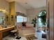 Large bathroom with double sinks, corner tub, and separate shower at 33255 State Road 70 E, Myakka City, FL 34251