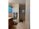 Bathroom with shower, toilet and wooden vanity at 33255 State Road 70 E, Myakka City, FL 34251