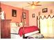 Spacious bedroom with a king-size bed and a ceiling fan at 33255 State Road 70 E, Myakka City, FL 34251