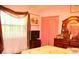 Charming bedroom with a double bed, window, and dresser at 33255 State Road 70 E, Myakka City, FL 34251