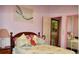 Cozy bedroom with a double bed and mirrored closet doors at 33255 State Road 70 E, Myakka City, FL 34251