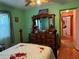 Bedroom with double bed, dresser, and ceiling fan at 33255 State Road 70 E, Myakka City, FL 34251