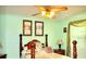 Serene bedroom with a double bed, a ceiling fan, and lovely artwork at 33255 State Road 70 E, Myakka City, FL 34251