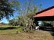 Carport with storage and vehicle at 33255 State Road 70 E, Myakka City, FL 34251