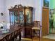 Classic wooden dining set with a large china cabinet at 33255 State Road 70 E, Myakka City, FL 34251