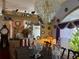 Elegant dining room with a large table, chandelier, and decorative plates at 33255 State Road 70 E, Myakka City, FL 34251