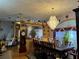 Elegant formal dining room, chandelier, and large windows at 33255 State Road 70 E, Myakka City, FL 34251
