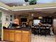 Kitchen with island, dining area, and living room view at 33255 State Road 70 E, Myakka City, FL 34251