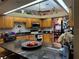 Kitchen with wooden cabinets and granite countertops at 33255 State Road 70 E, Myakka City, FL 34251