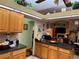 Kitchen with an island and view into living room at 33255 State Road 70 E, Myakka City, FL 34251